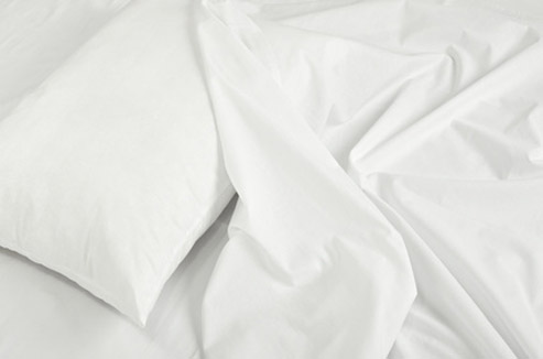 Couette, oreillers, rideaux... Comment les laver en machine ?